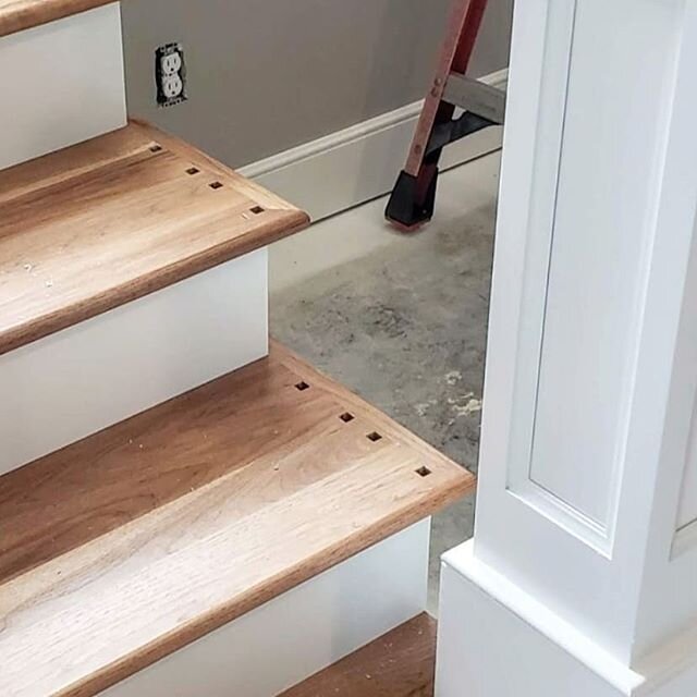 Occasionally we have a baluster selected that is a square cut on the bottom. Our carpenters take the treads back to their shop and use a mortise machine so each hole is perfectly square to accept the baluster. It's a little detail, but it looks so ni