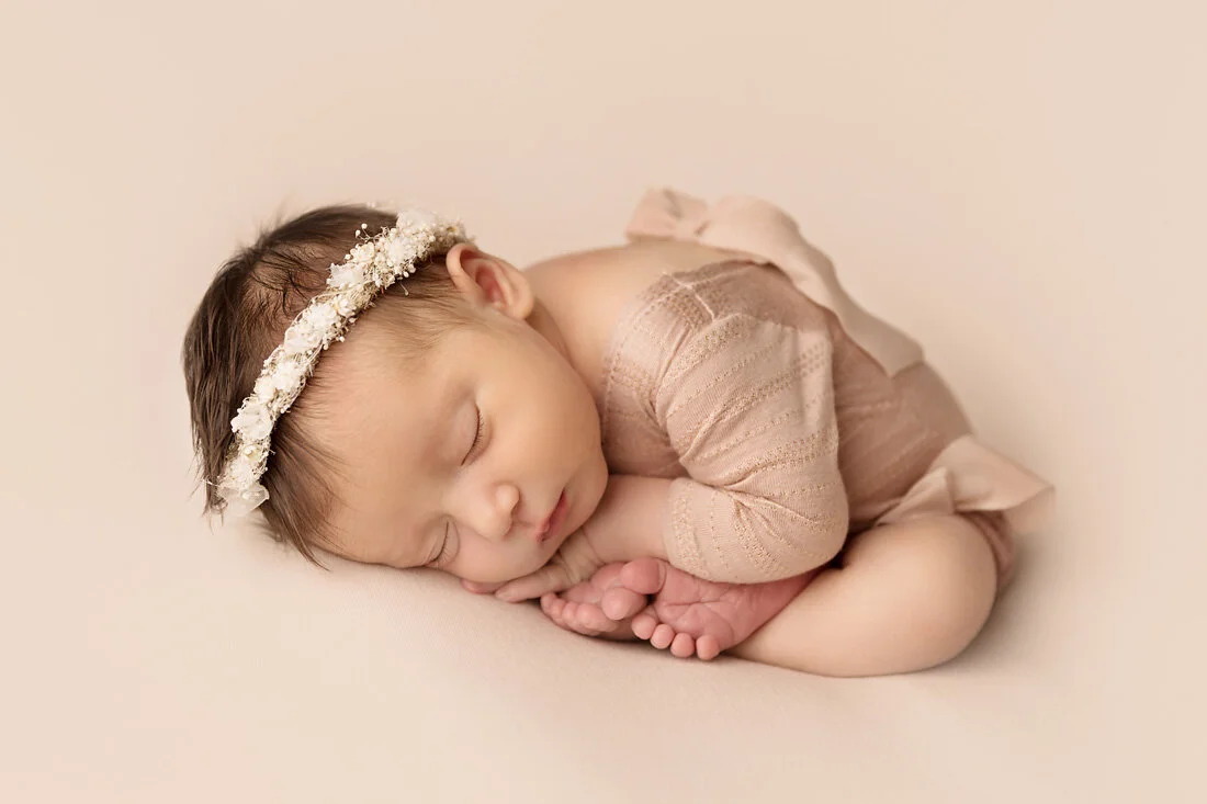 baby girl in taco newborn pose