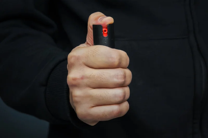 bigstock-Hand-With-Bottle-Of-Pepper-Spr-209465386.jpg