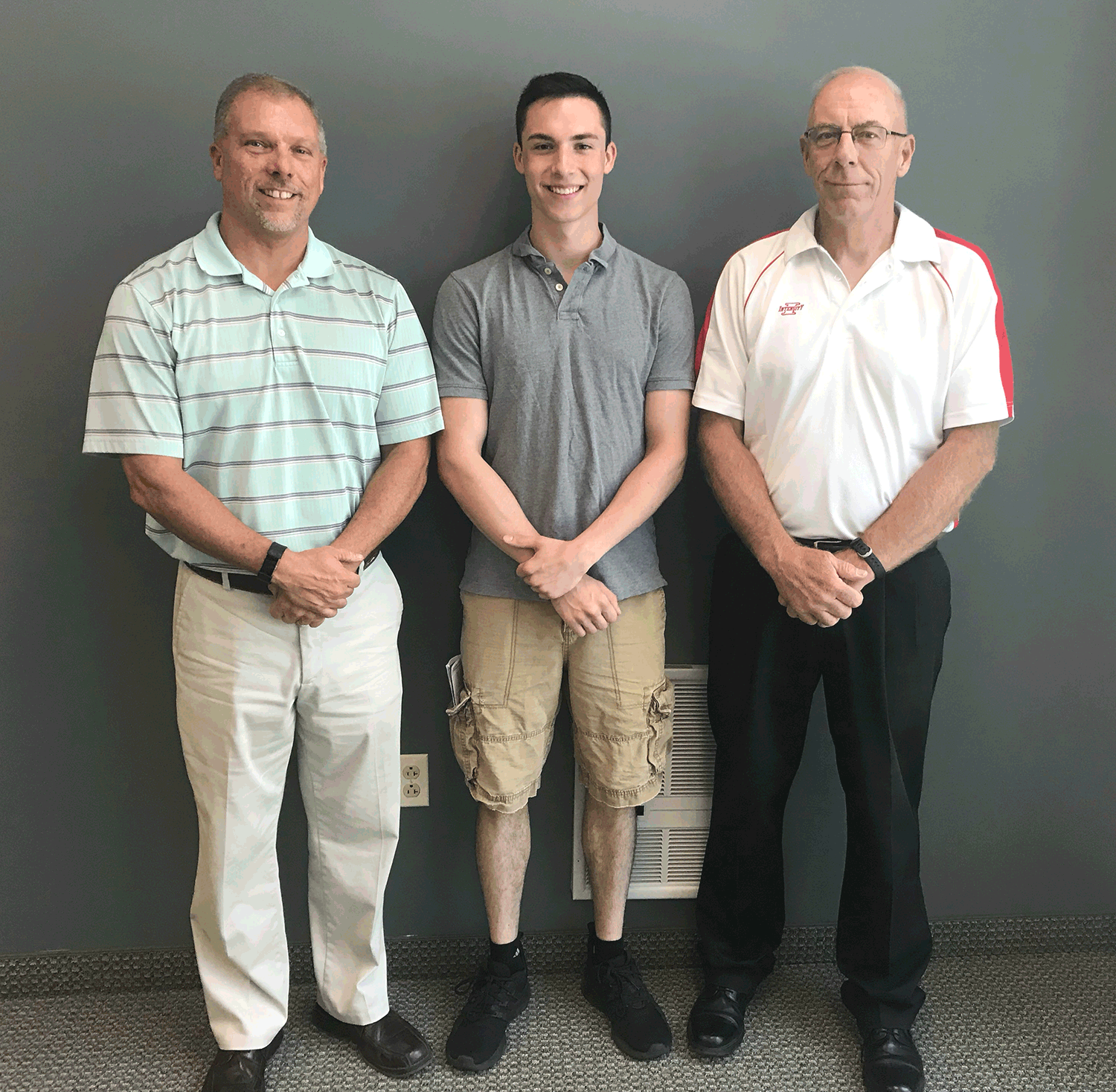 Gus Evans (c) after being prayed over by Redeemer Lutheran Church as he prepares to leave for United States Marine Corps bootcamp in Parris Island, SC. Gus is seen here with a couple of Redeemer’s Marines, Ron Reimert (l) and Steven Koepsel (r).