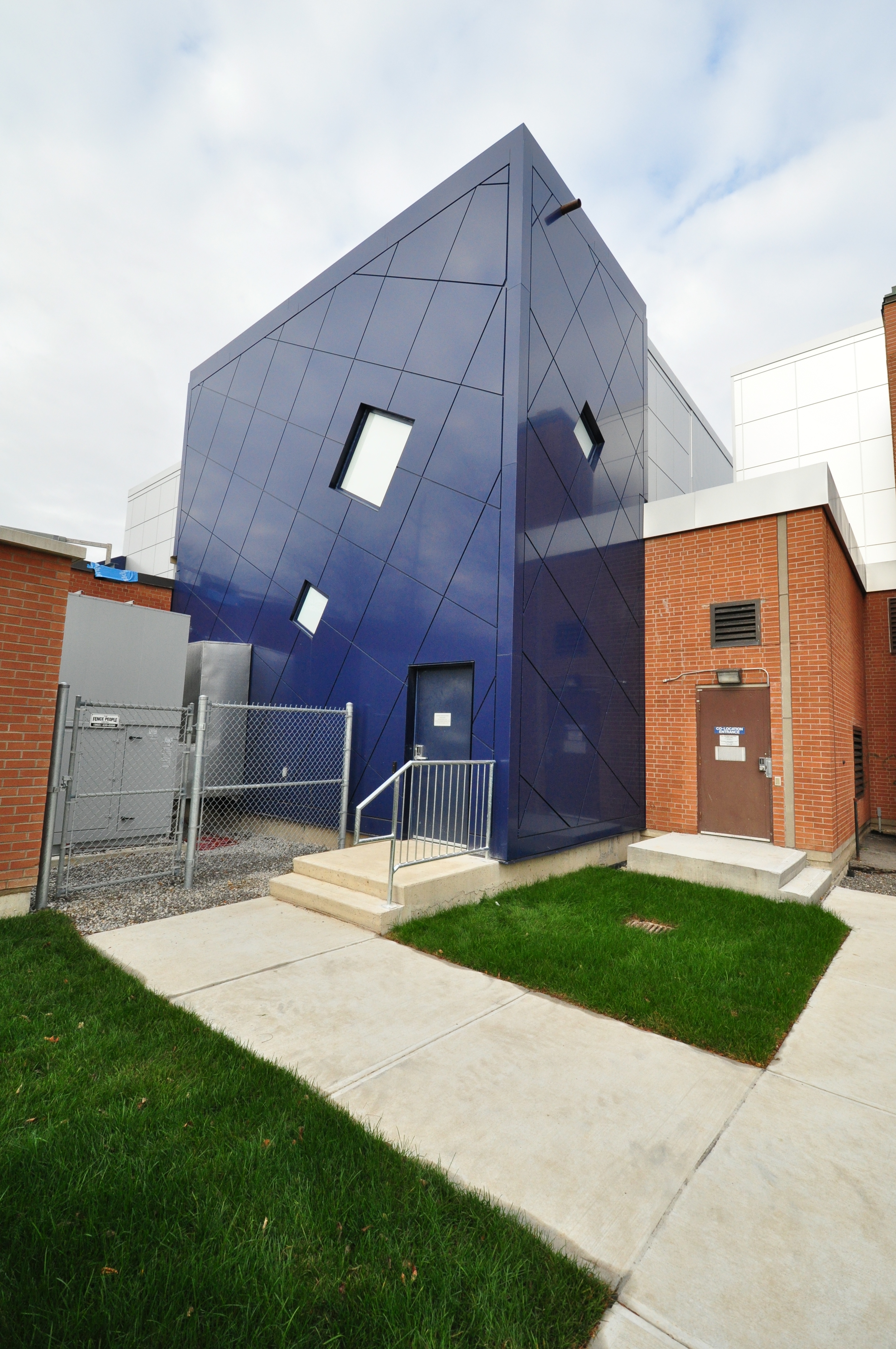 Beginning with a feasibility study, Melillo Architects Incorporated evaluated various concepts to provide new equipment space for this existing Bell Canada automated telephone exchange. The selected option was developed into a complete design addressing various technical criteria including equipment requirements and conformance to NFPA 76. Extensive interaction with Bell authorities resulted in a design that met the requirements of the client while expressing a distinct building identity to meet City development guidelines for the area.