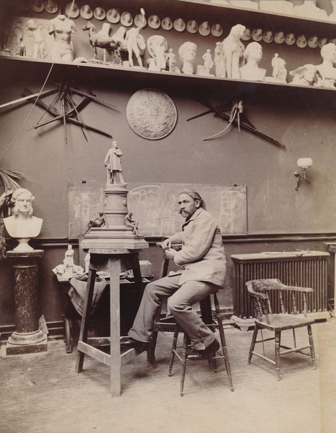 Ward in his studio, circa 1885, working on his model of the statue of President James A. Garfield