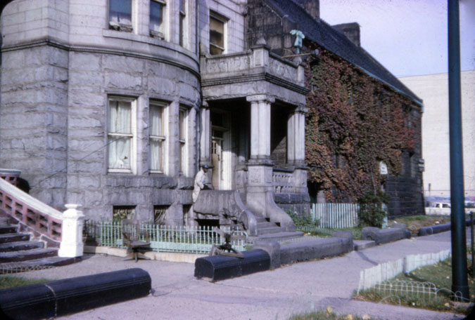 Charles A. Jackson sitting on the porch of 1808 S. Prairie Avenue in 1965 (Photo by Jack Simmerling)