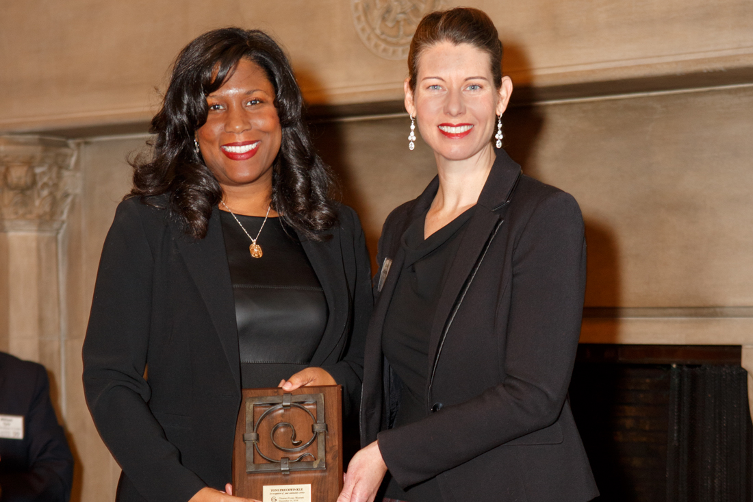 Jessica Caffery accepting award from Bonnie McDonald