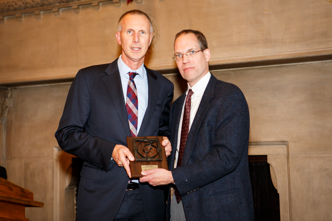 Jack Tribbia accepting award from John Waters
