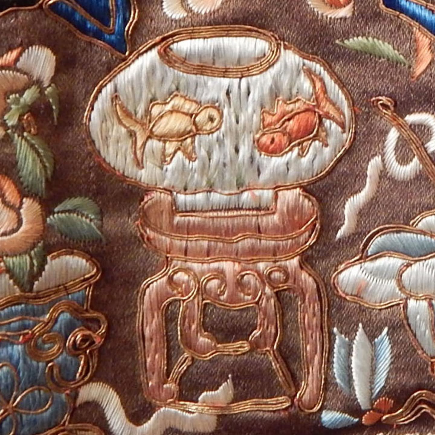 This week&rsquo;s Photo Friday shows a detail from a pair of embroidered drapery panels on the music cabinet in the parlor. 

The panels originally formed a mamianqun, a traditional Chinese skirt which Frances Glessner repurposed. This detail, which 