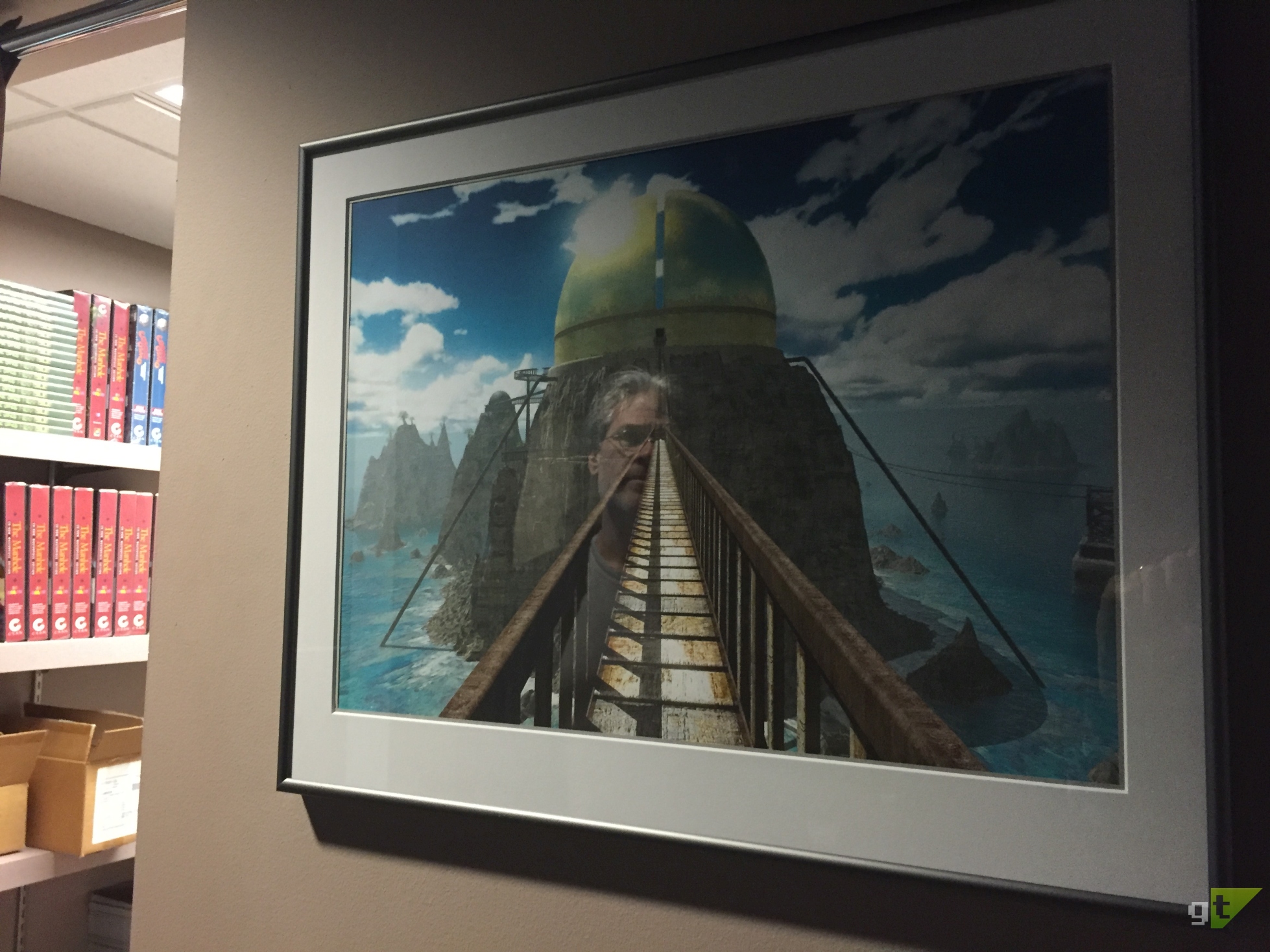 Rand Miller, co-creator of the Myst series, reflecting, literally, on a limited edition print of a render from the game Riven .