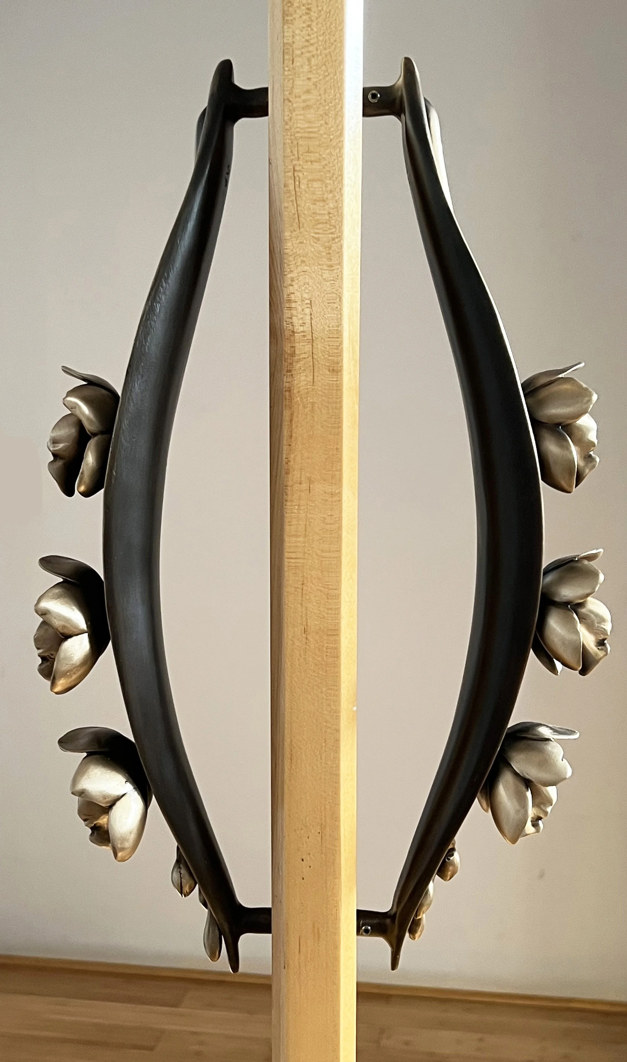Sculptural bronze orchid entry door pull crafted as functional art for high-end architectural design