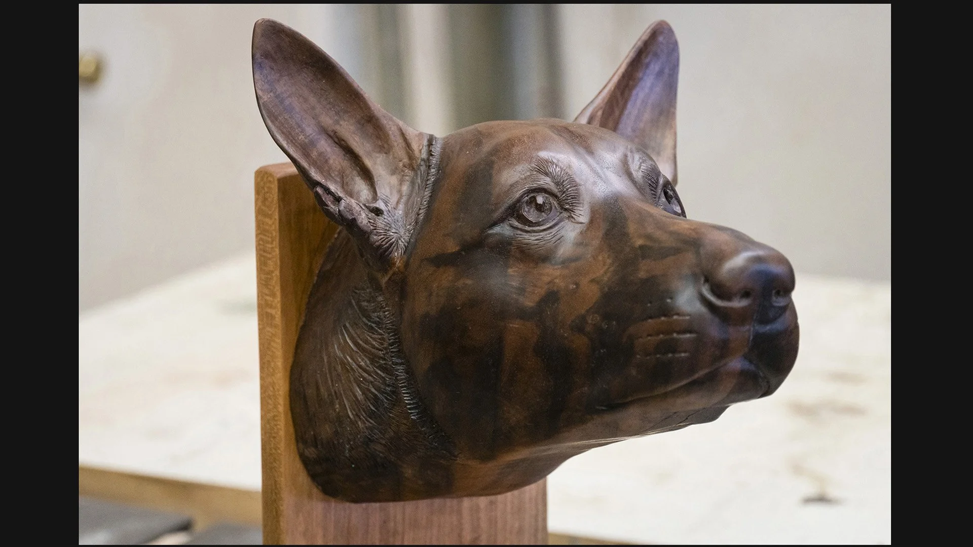Thumbnail image of the completed Doug dog portrait carved in walnut by Martin Pierce