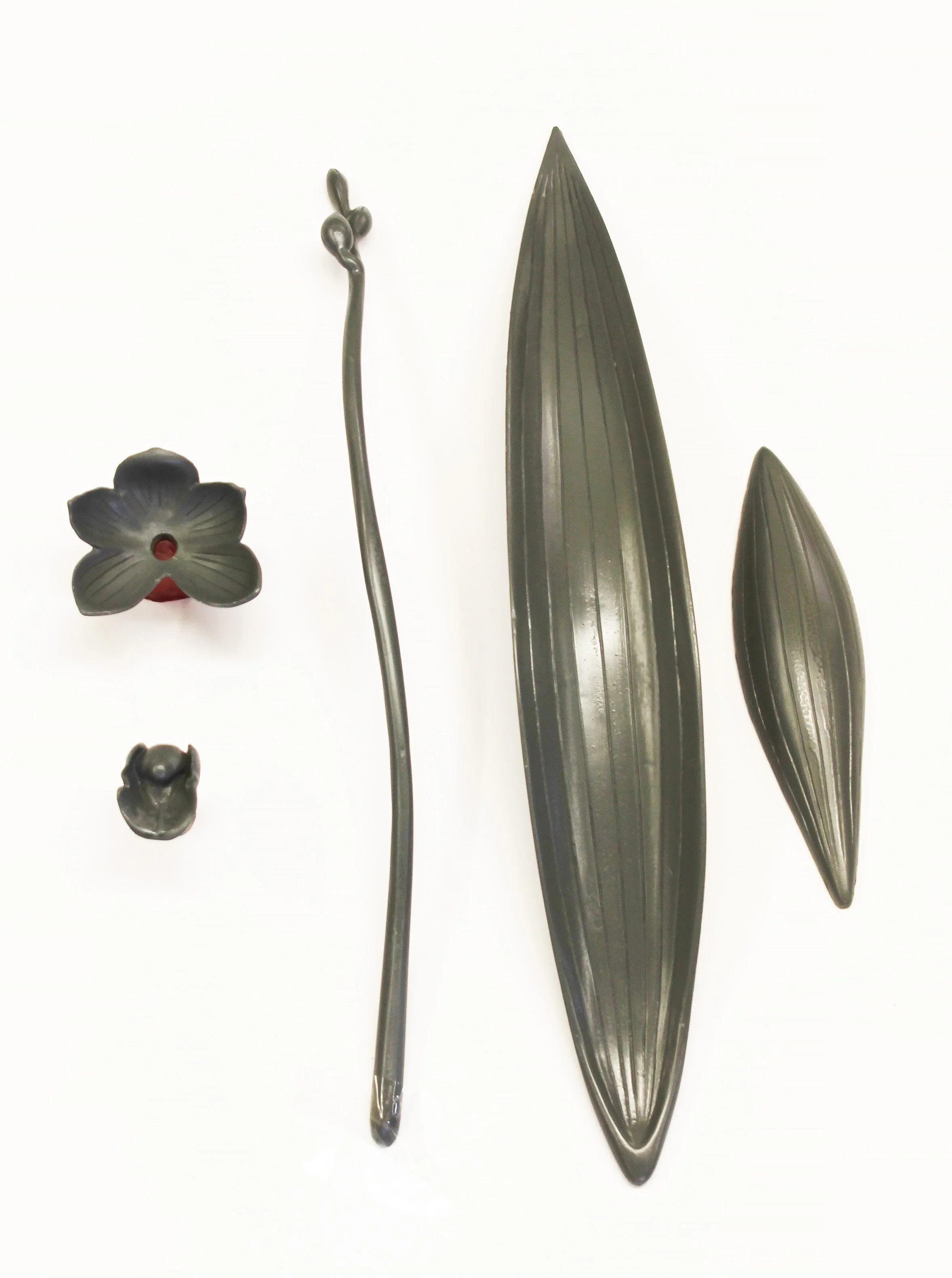 Original sculpted orchid patterns used to create bronze orchid spray door pulls before lost-wax casting