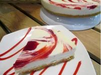  RASPBERRY Raspberry filling generously swirled into our classic cheesecake makes this an all time favorite! 