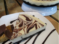  PEANUT BUTTER Creamy peanut butter cheesecake with a chocolate swirl on a chocolate cookie crust
