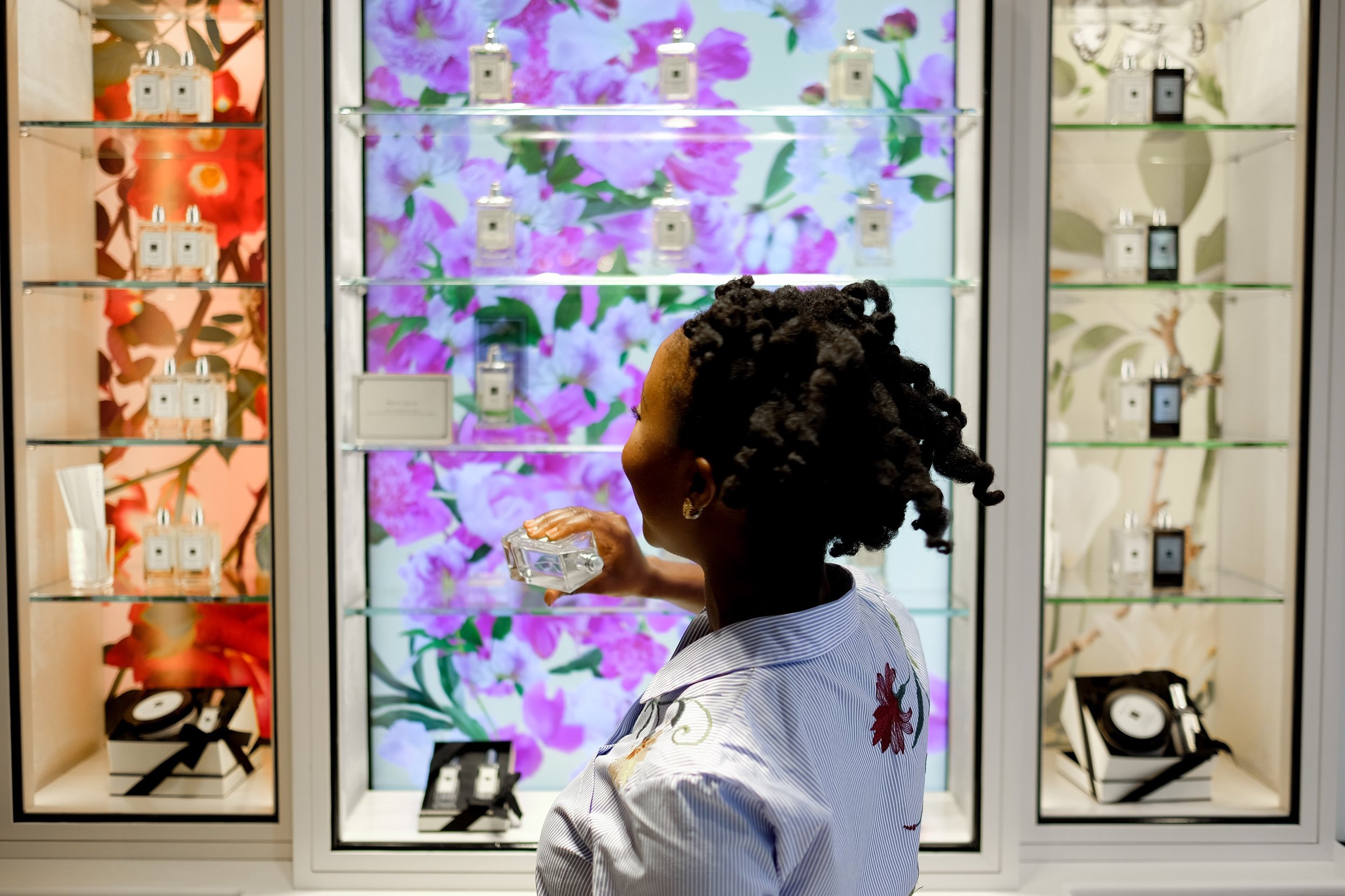 I was fascinated by their fragrance wall. The background pictures change when you lift a fragrance off the shelf. How cool is that?