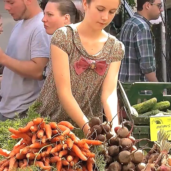 Arranging the produce to look its best.