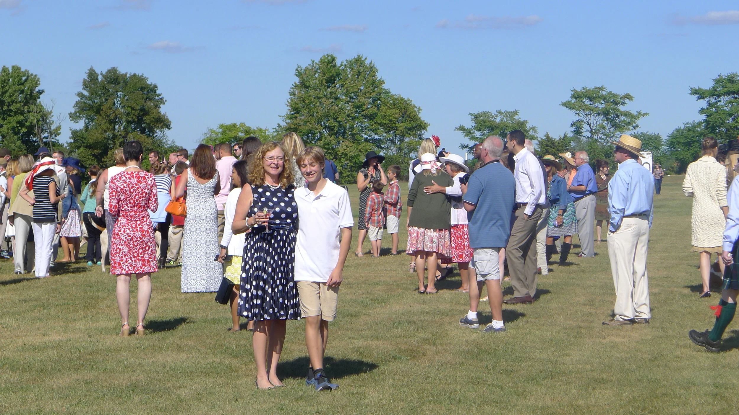 Suzanne and son, William, out on the field to meet the hounds and stomp the divots