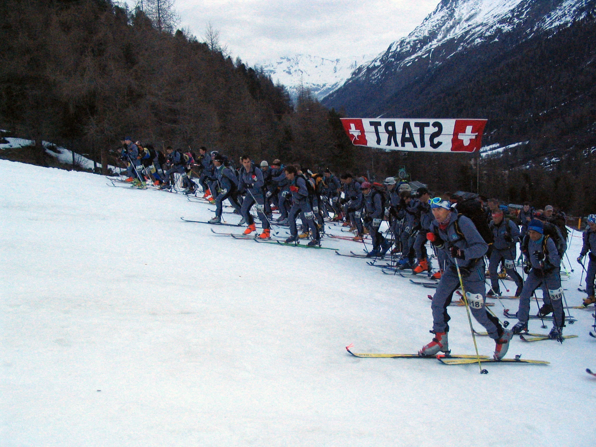 Then & now: The start of the military patrol training run in 1932 (above) and the start of the annual Patrouille des Glaciers competition in Switzerland (below)