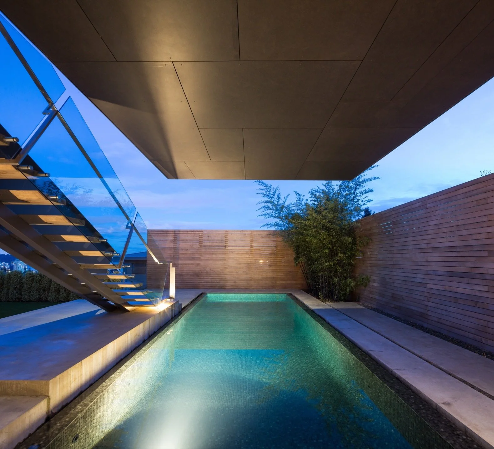 the-swimming-pools-dark-tile-finish-mirrors-the-cantilevered-container-above-it.jpg