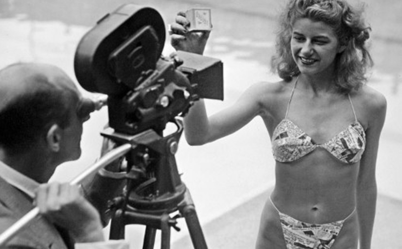 Nude dancer Micheline Bernardini wearing Louis Reard's 'Bikini' at a press conference, 1946