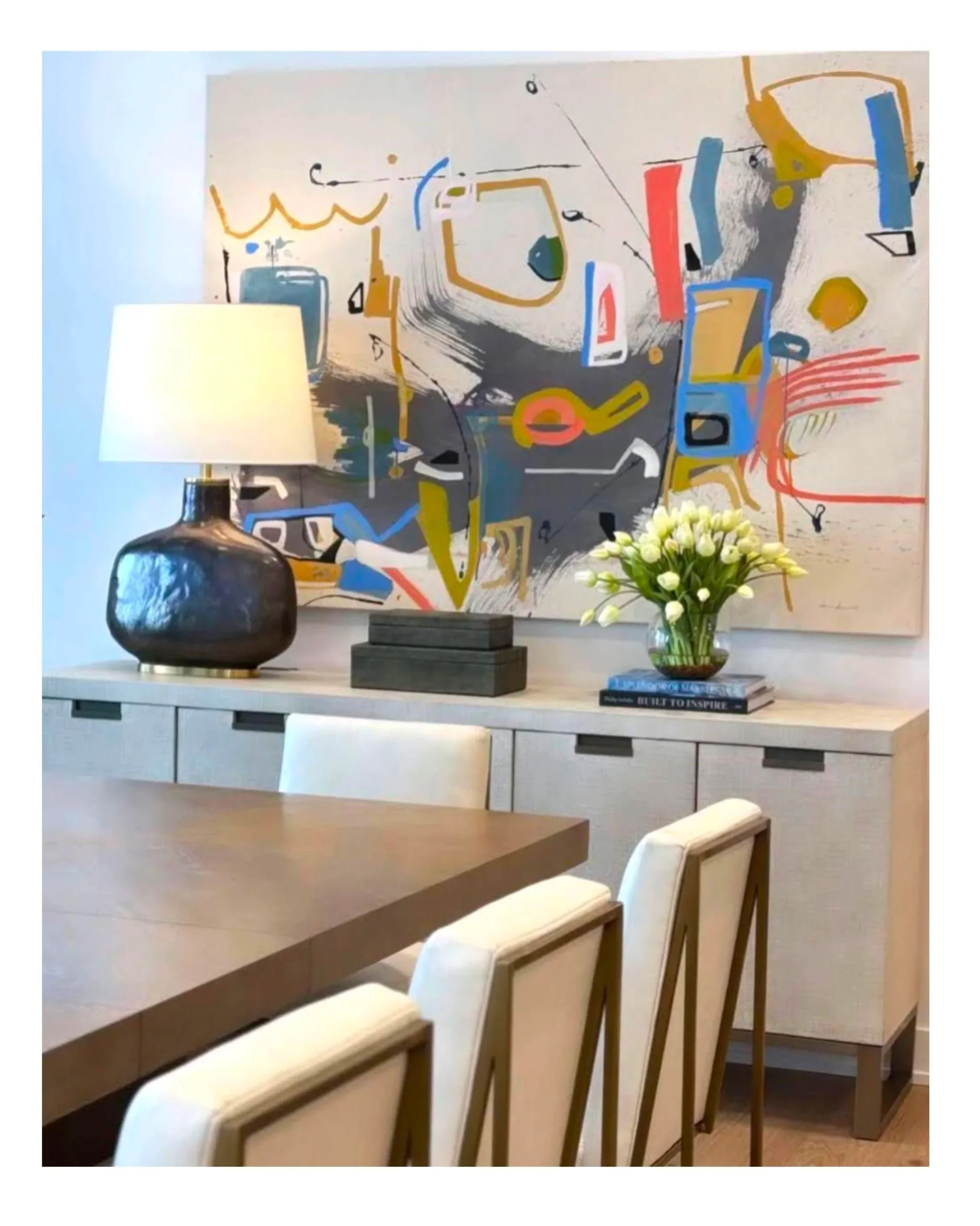 dining room by Bartholet Interior Design with large abstract painting by Anne Abueva