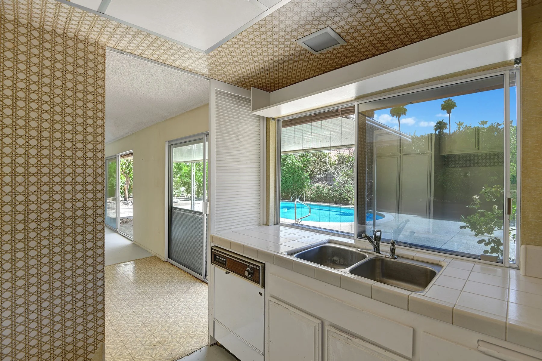 KITCHEN REVERSE OUT TO POOL YARD MLS.jpg