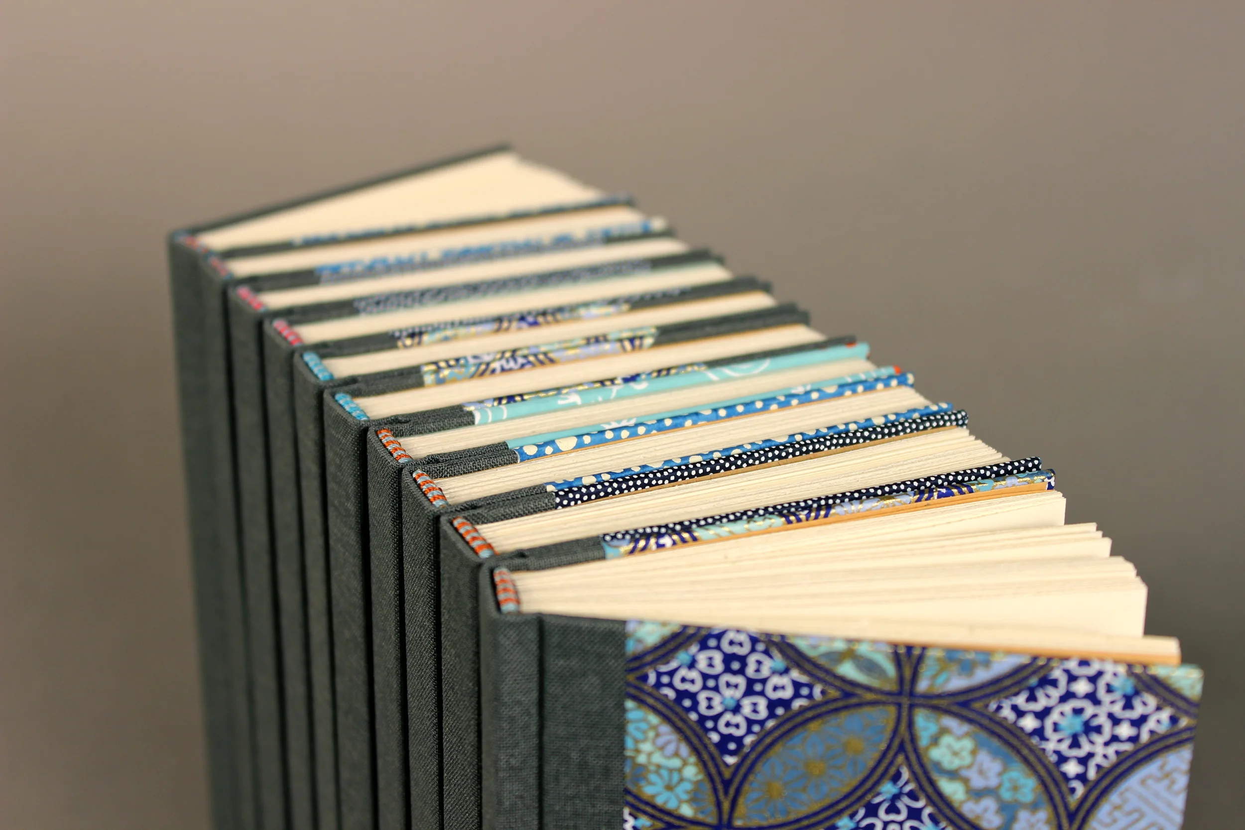 Flat spine case bindings