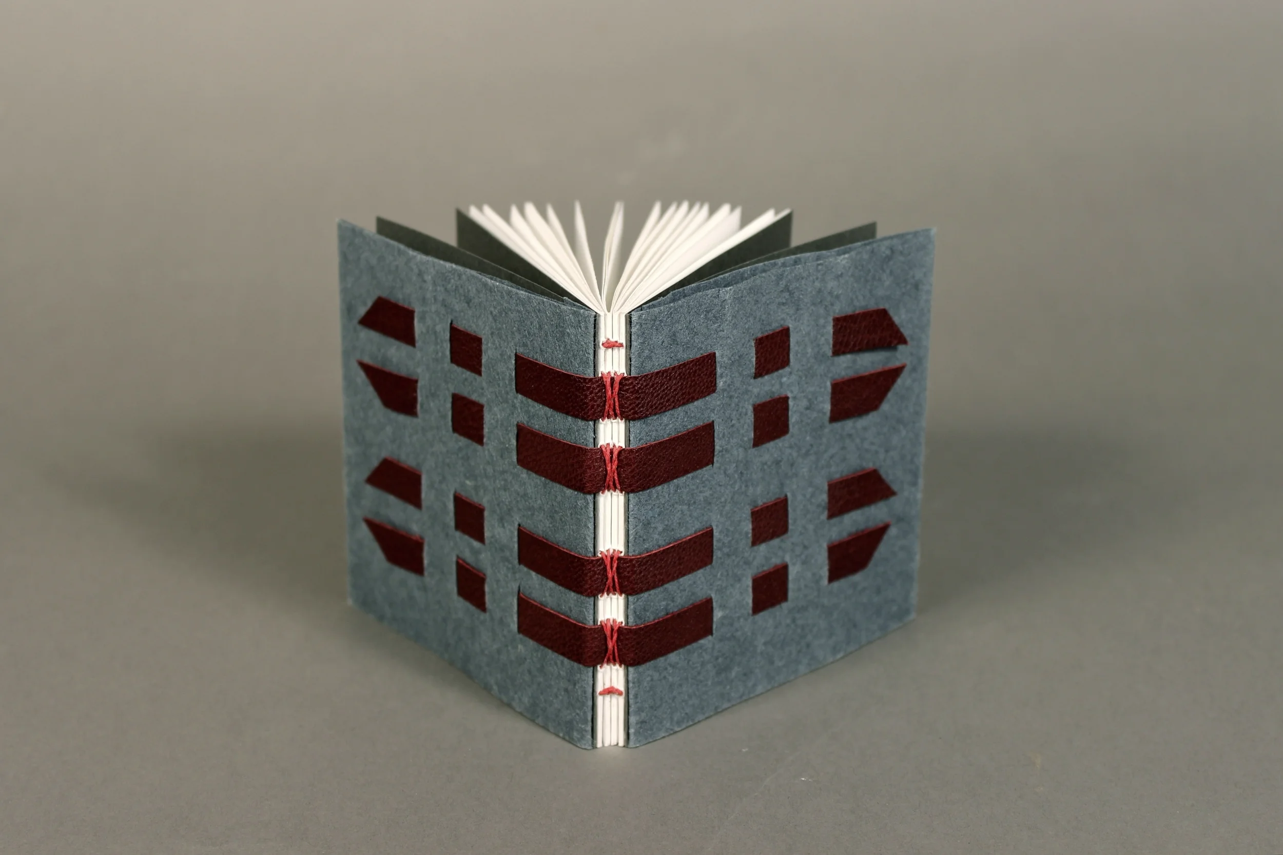 Modified slotted tape binding 