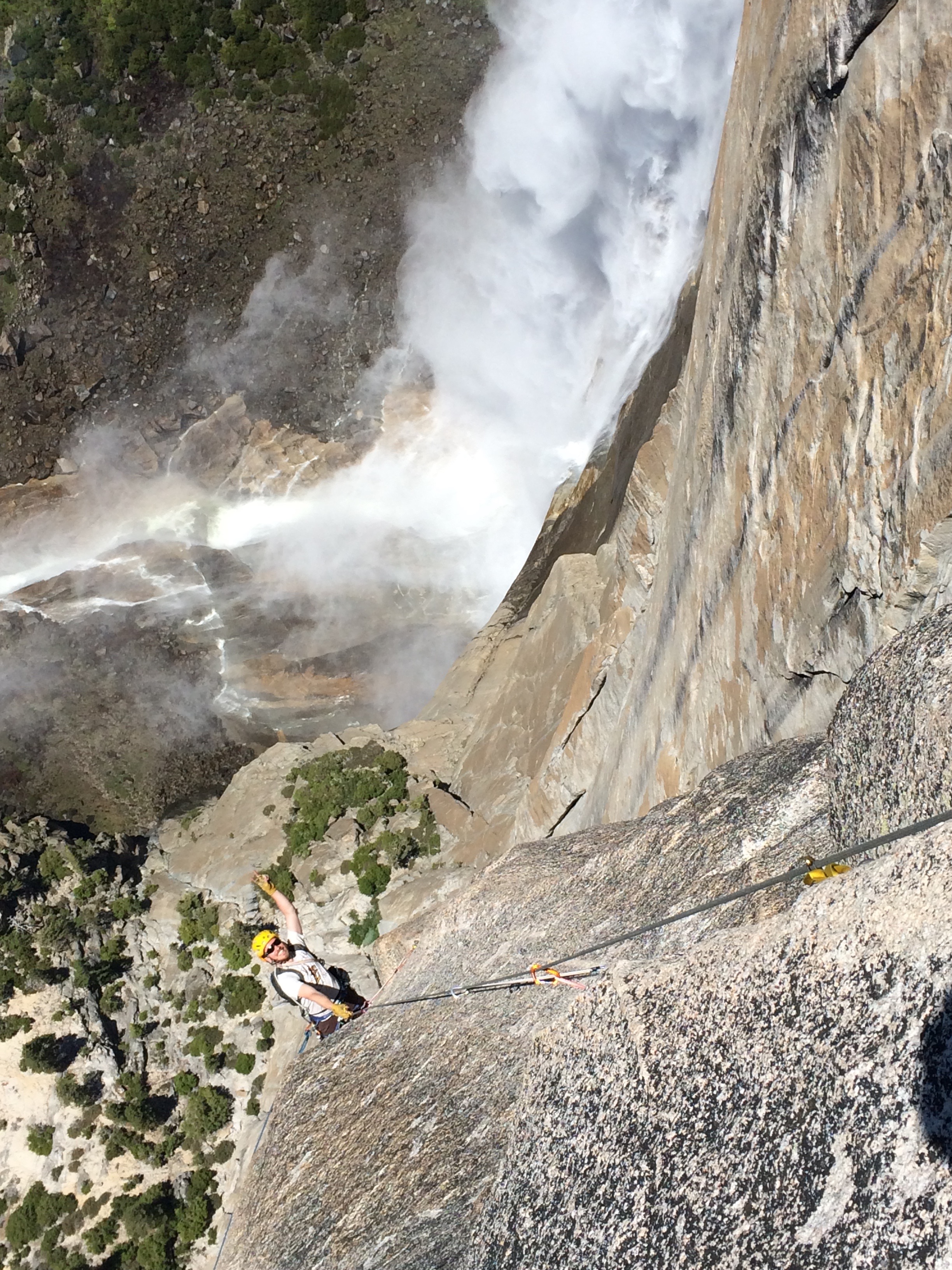 Jugging the last pitch, with Yosemite Falls in the background. 