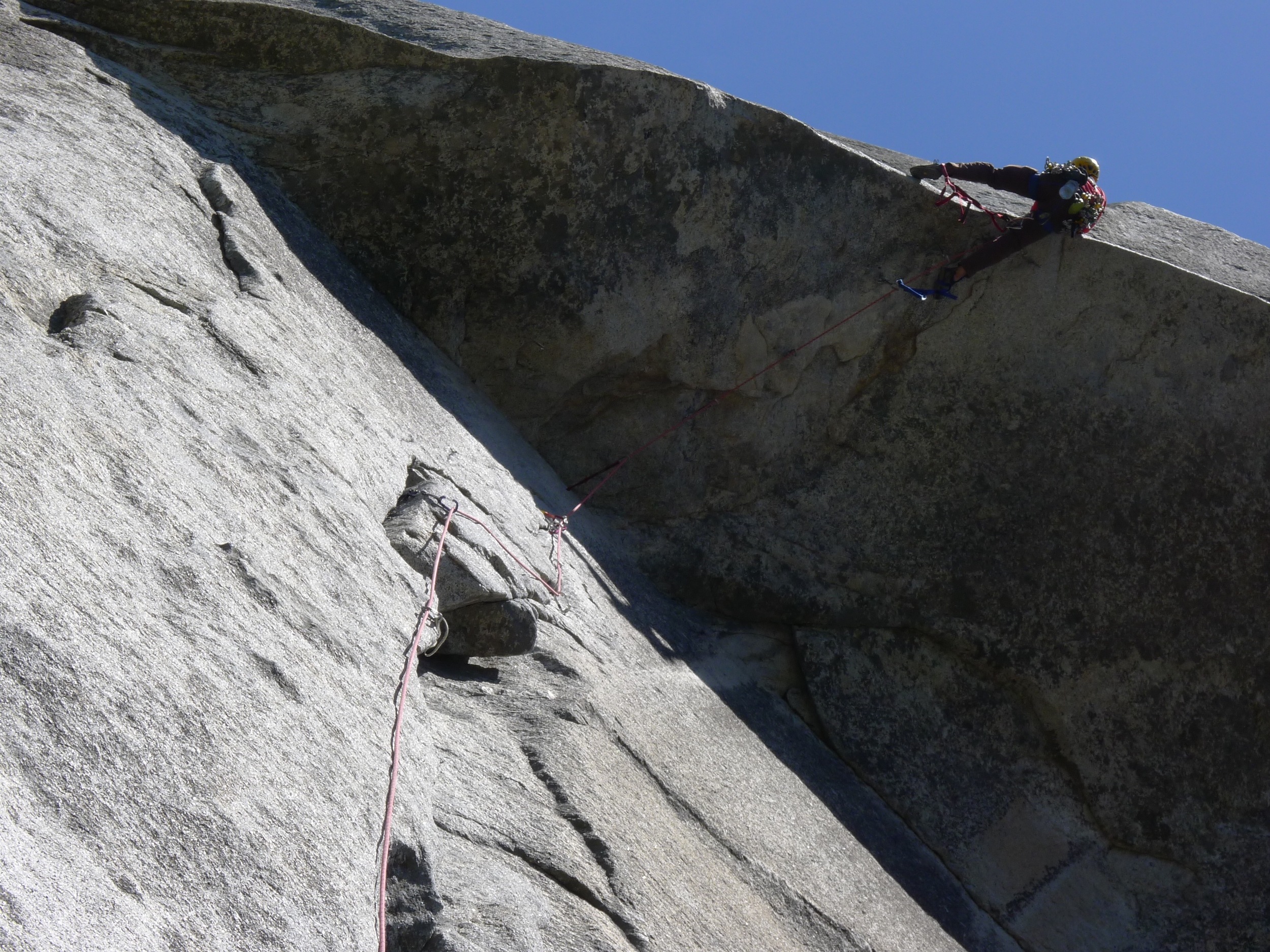 Standing in the top step of the aiders to pull the lip of the Kor Roof