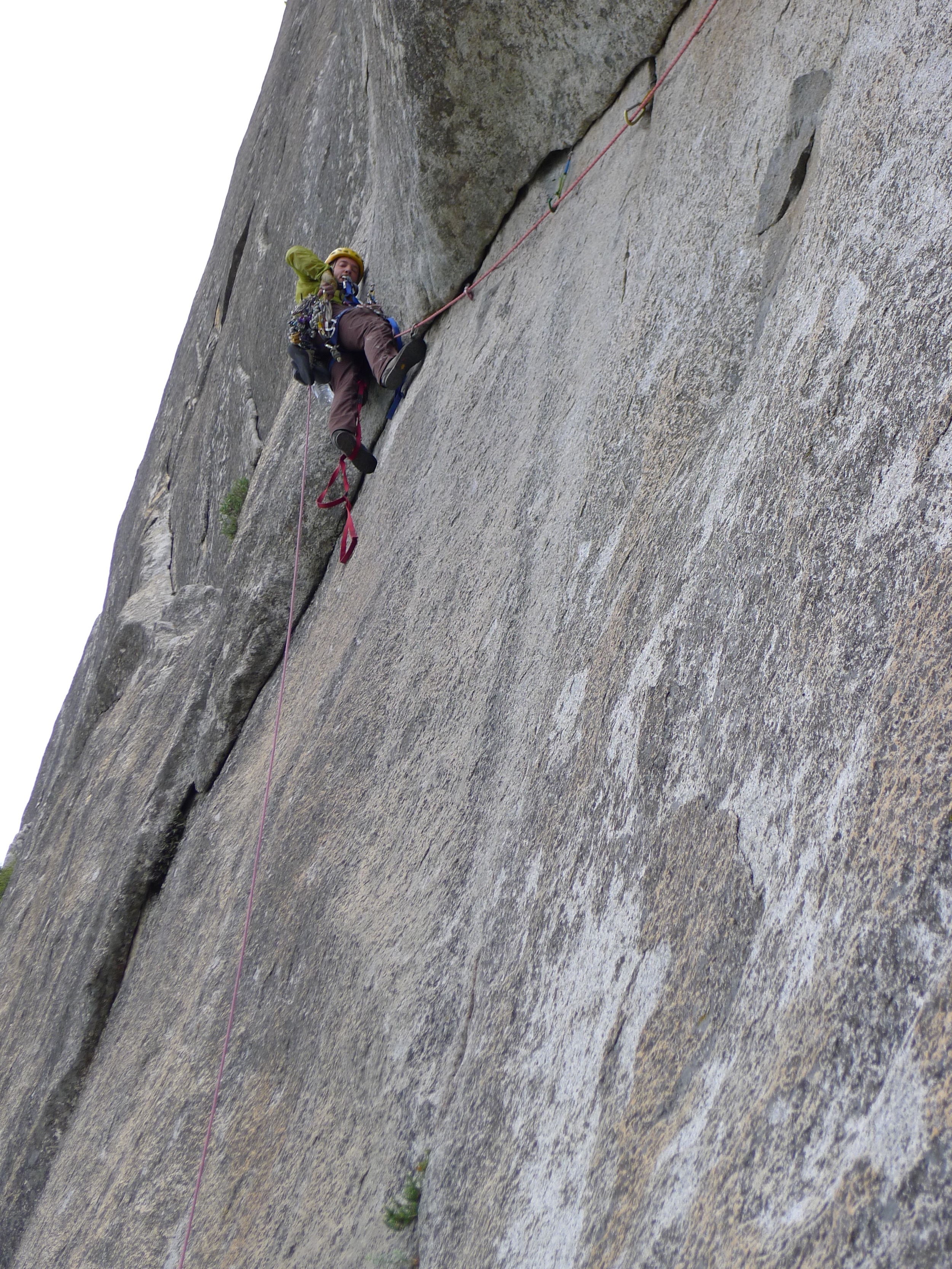 My longest aid lead of the trip, about 150' of an overhanging arch to a thin seam. The mental crux was stepping out of the aiders near the top and freeing a few 5.7 moves with a full aid rack on and in approach shoes!