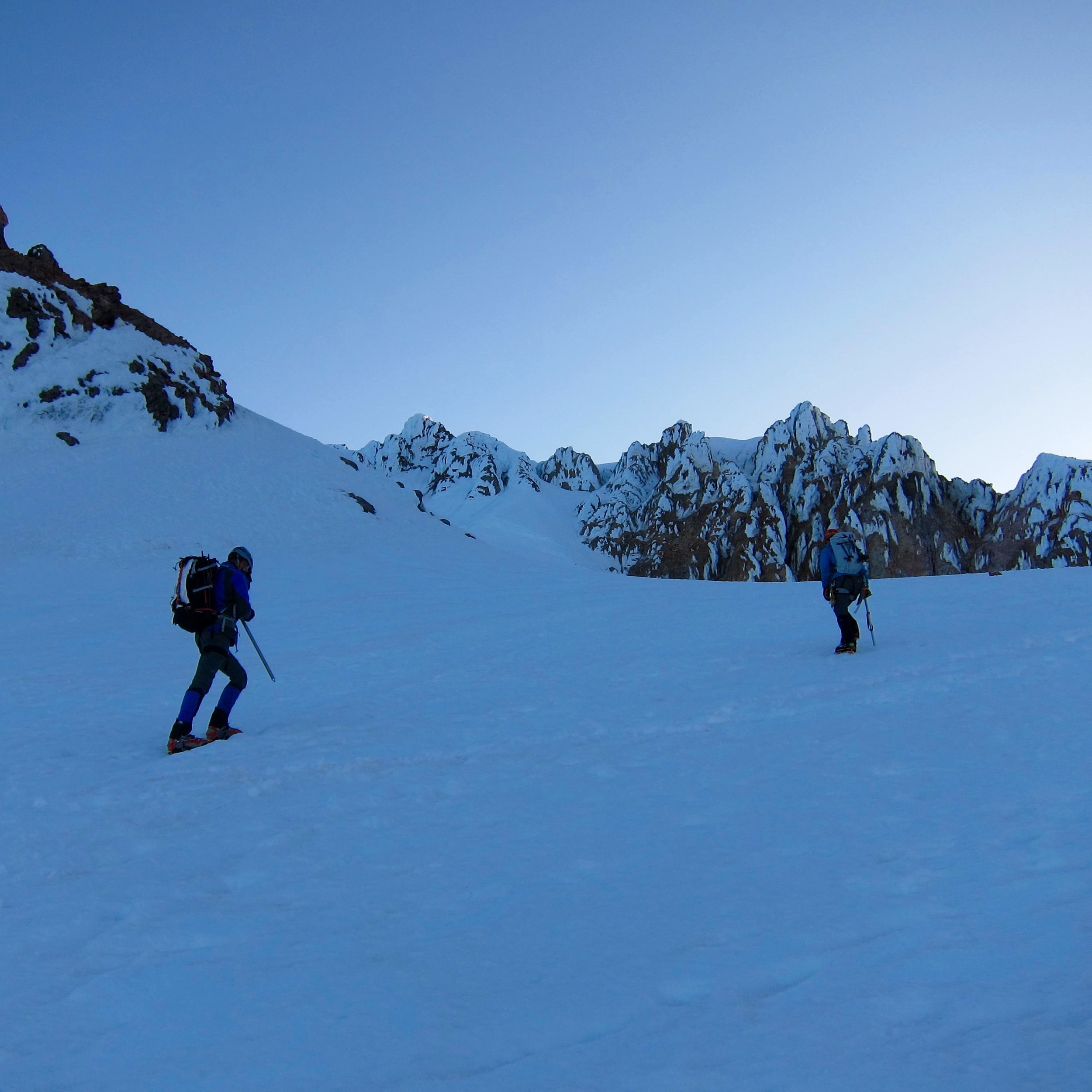 Heading up from the crater. The summit is above the buttresses in the center.