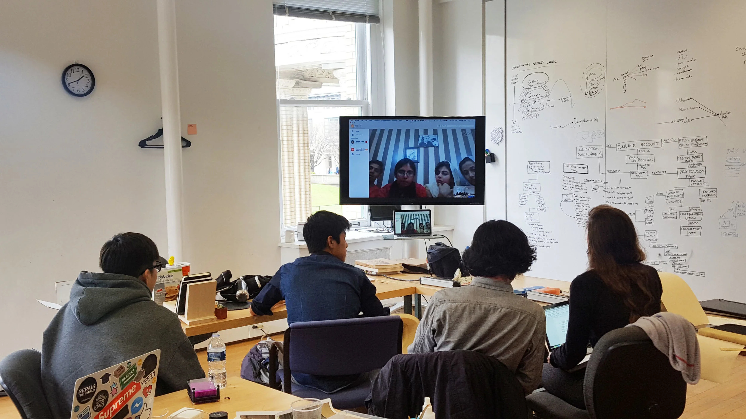Environments track (Ji Tae, Jasper, Chris, and Gilly) sharing concepts with four students from the University of Karachi Graphic Design program.