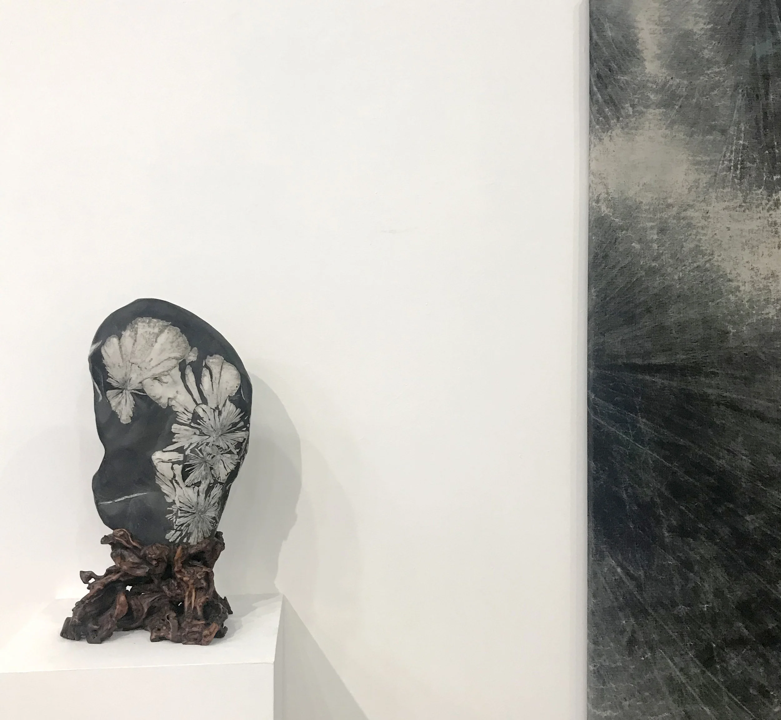 A viewing stone and detail of Cole Sternberg’s “trails through the interior: fall” (Marcus Herse).