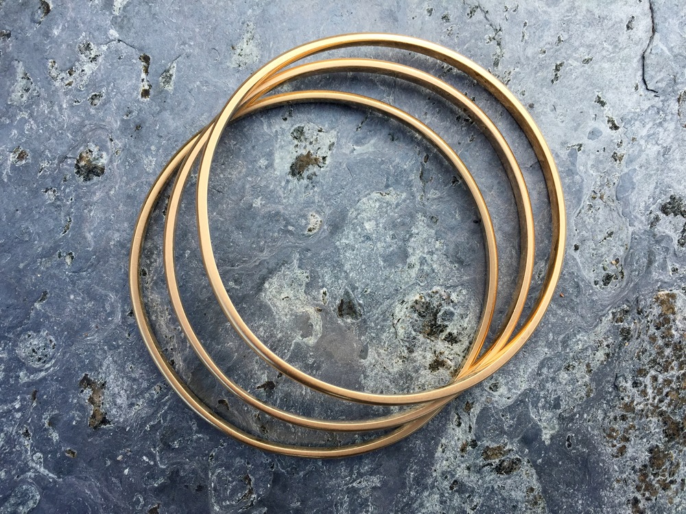 Solid gold signature bangle