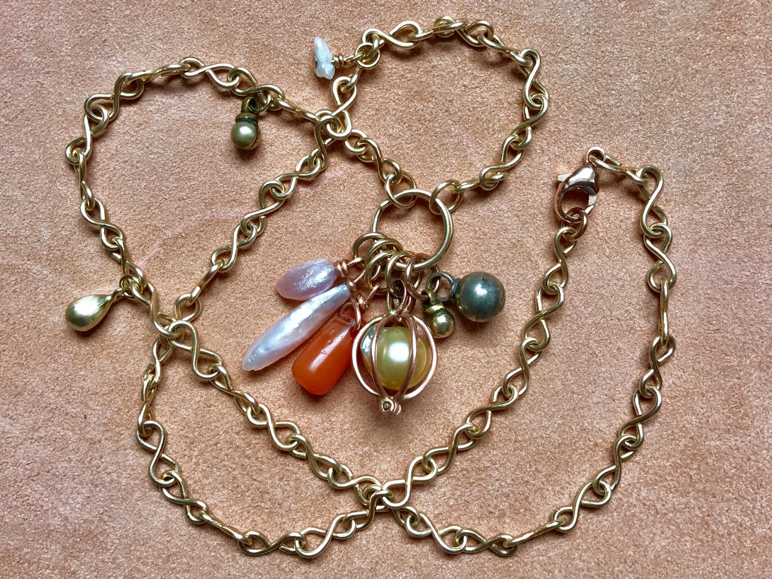 INFINITY CHAIN WITH MISSISSIPPI PEARL, CARNELIAN, SOUTH SEA PEARL, BEDOUIN BELL PENDANT NECKLACE
