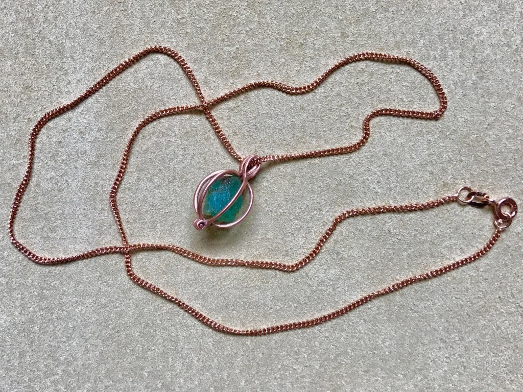 EMERALD GEM BASKET ON ROSE GOLD CURB CHAIN