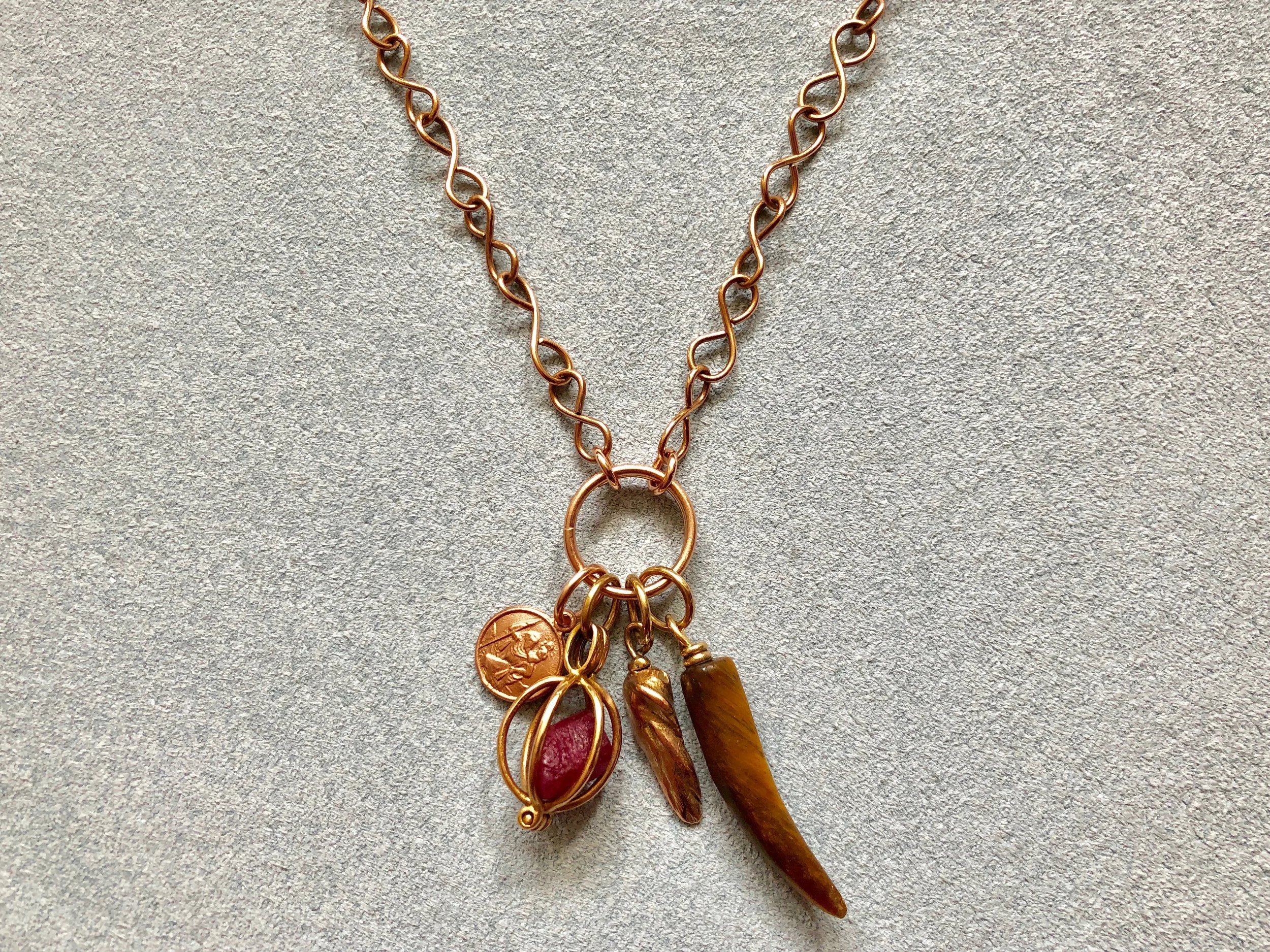 ROSE GOLD INFINITY CHAIN WITH ST. CHRISTOPHER, RUBY BASKET, MISSISSIPPI CAST & TIGERS EYE TUSK