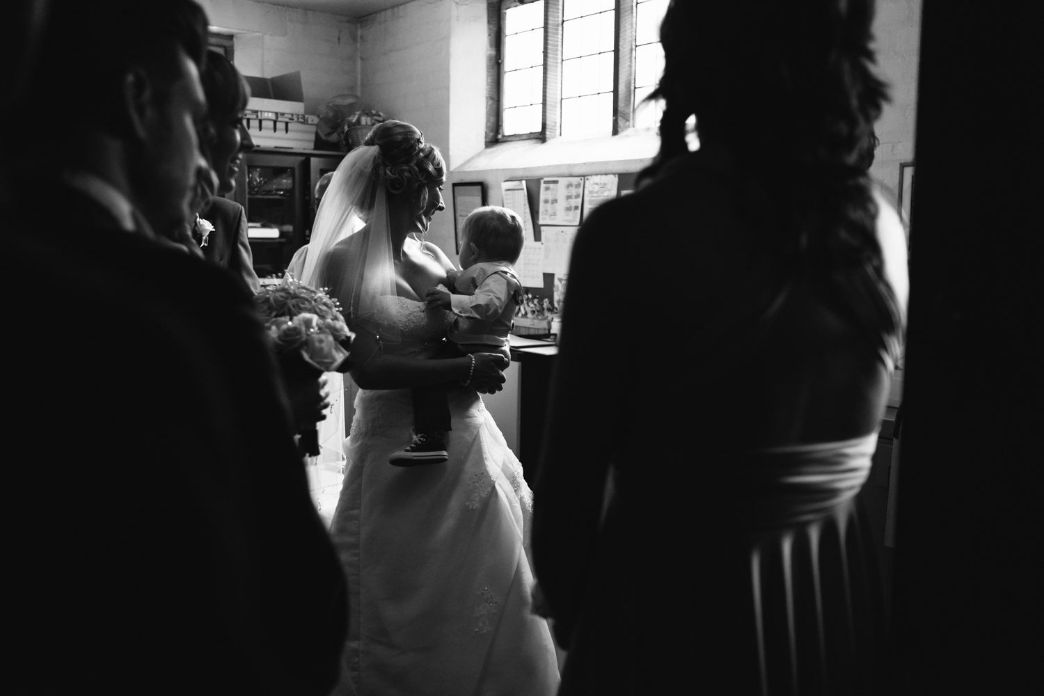 Amanda with her lovely son during the register signing at her Birmingham Wedding to Mark.