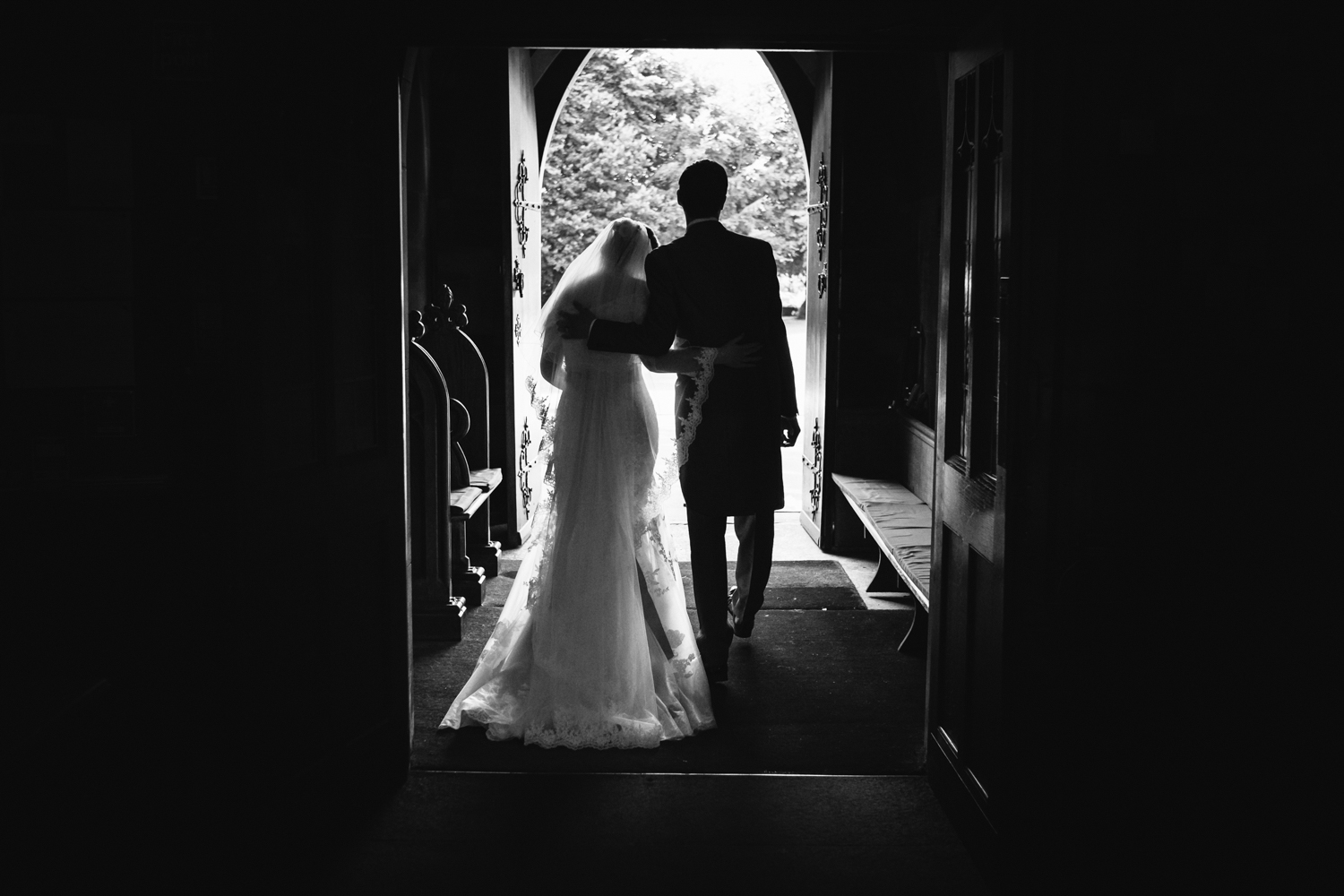 Alice and Wes leaving Church following their Staffordshire Rodbaston Hall Wedding.