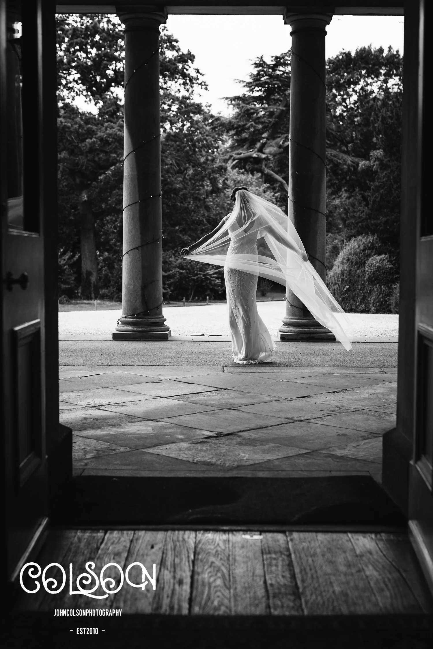 A beautiful bride at Prestwold Hall photographed by John Colson.