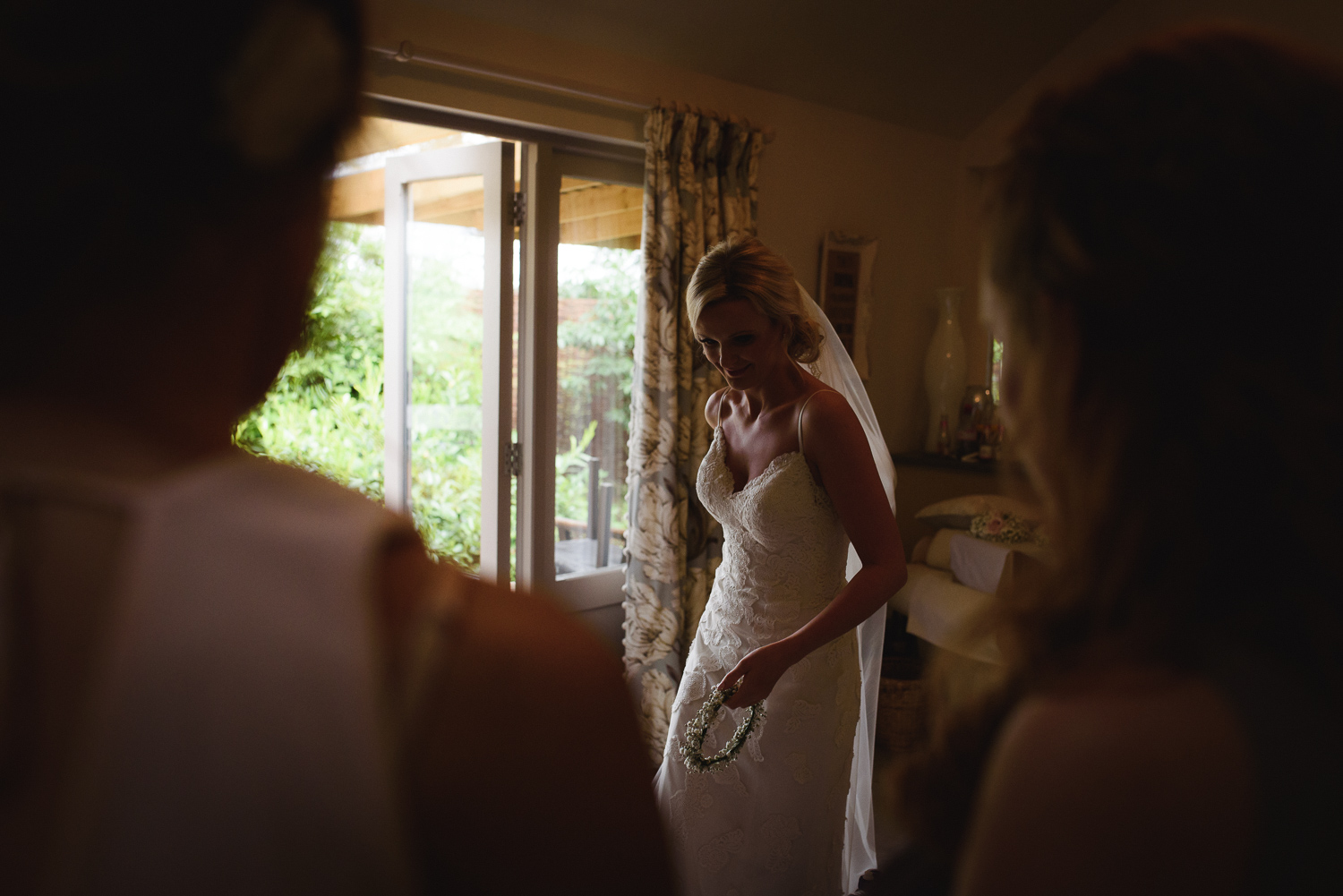 Getting ready for the Wedding Ceremony. Bridesmaids look on at Lemore Manor.