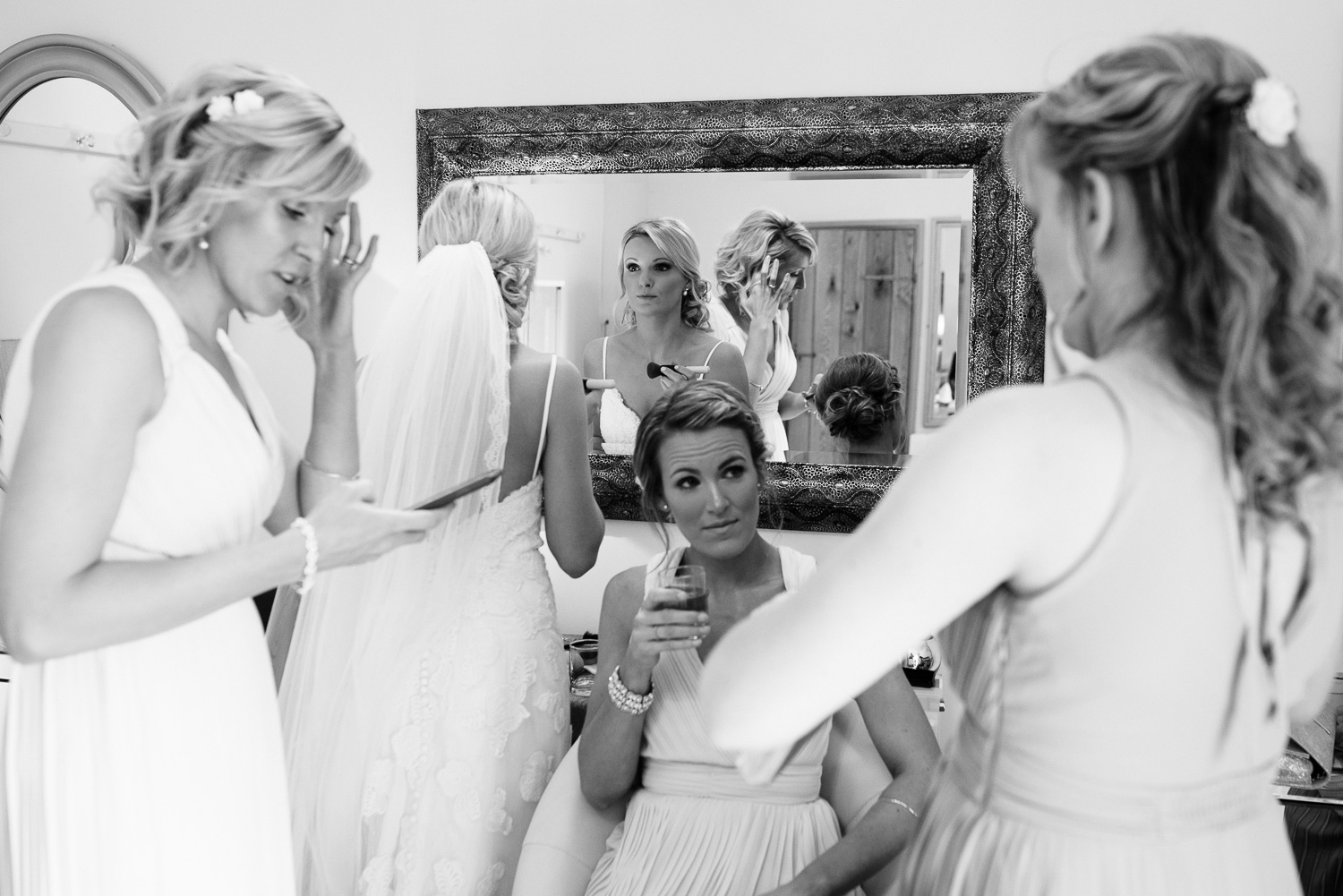 Last minute texts, wine and make up at Alice and Robs Herefordshire Wedding.