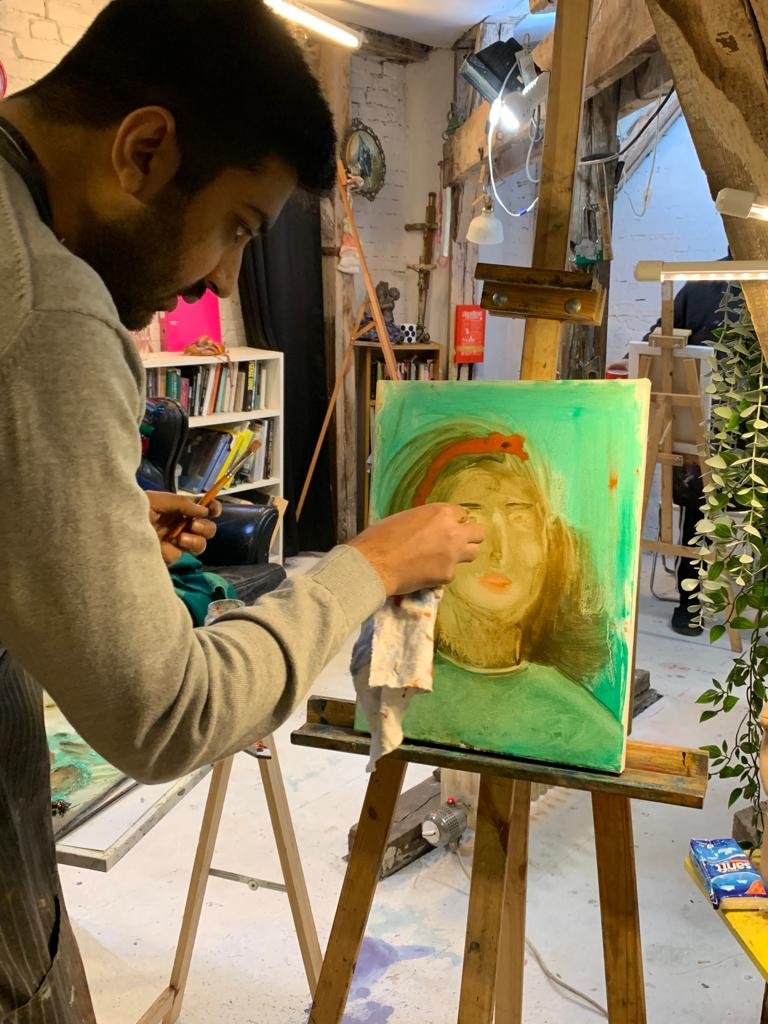 Adhmad painting the portrait.jpeg