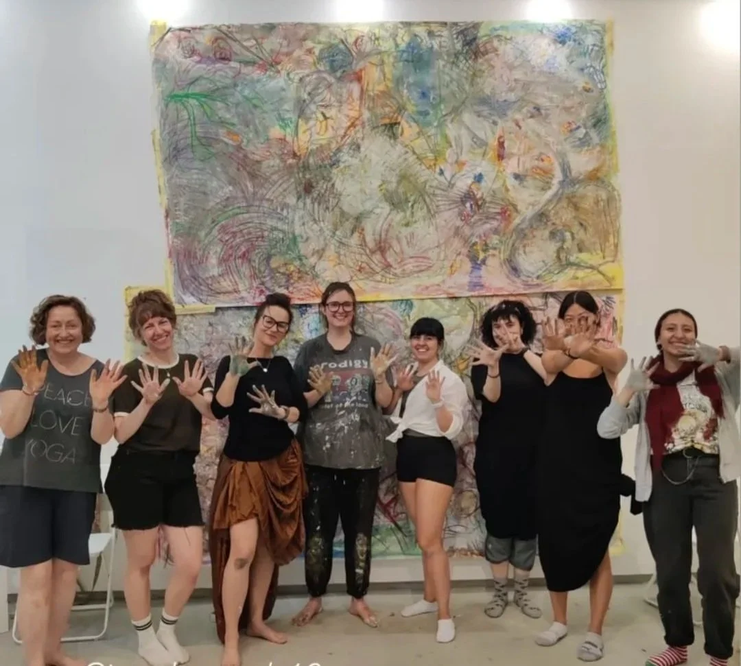 students with Hannah in the studio painting