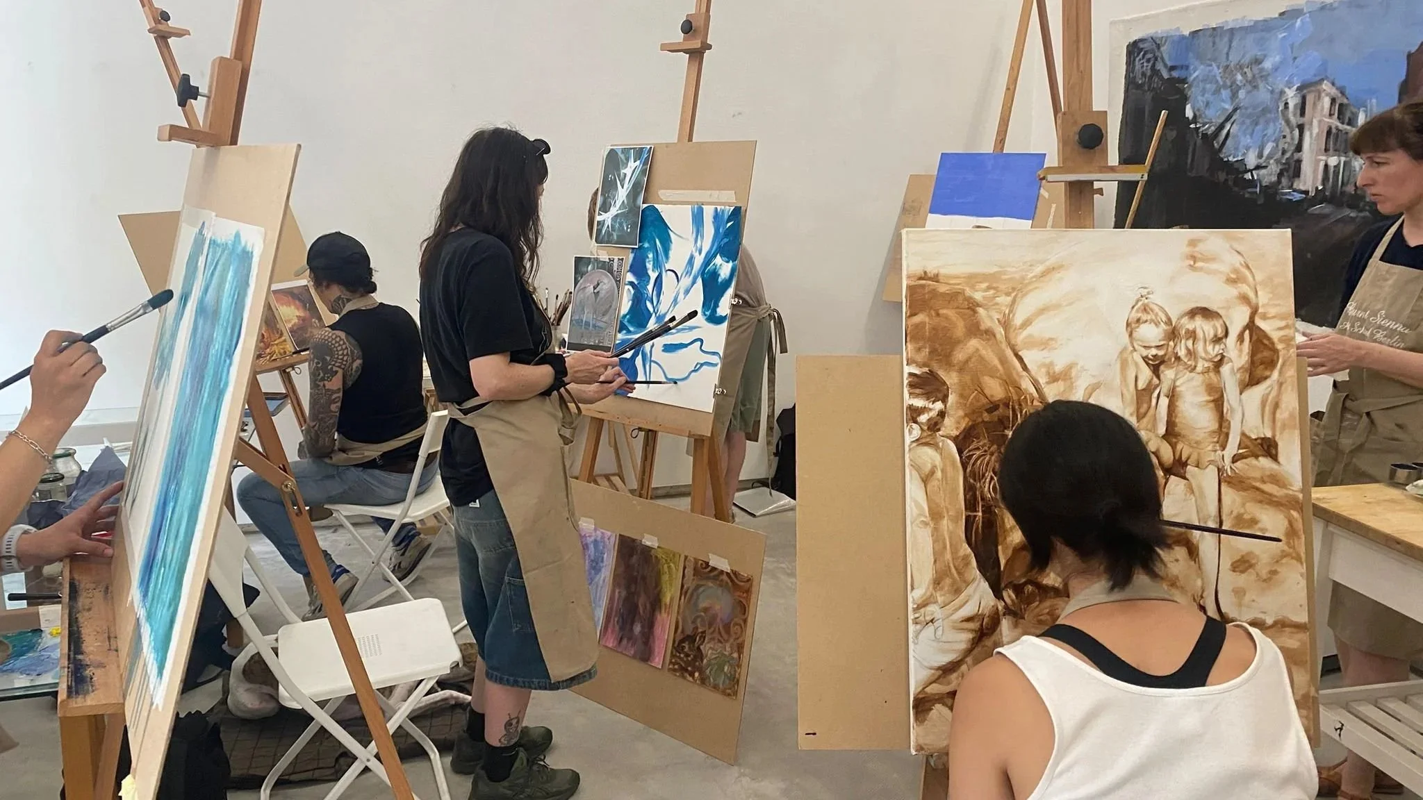 students working on paintings in the studio July 2026 Burnt Sienna Berlin