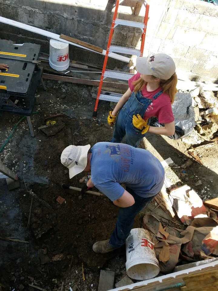 Ben Gourley and Bekah Wommack from Team Hot Pants are trying to plug a leak in the water line