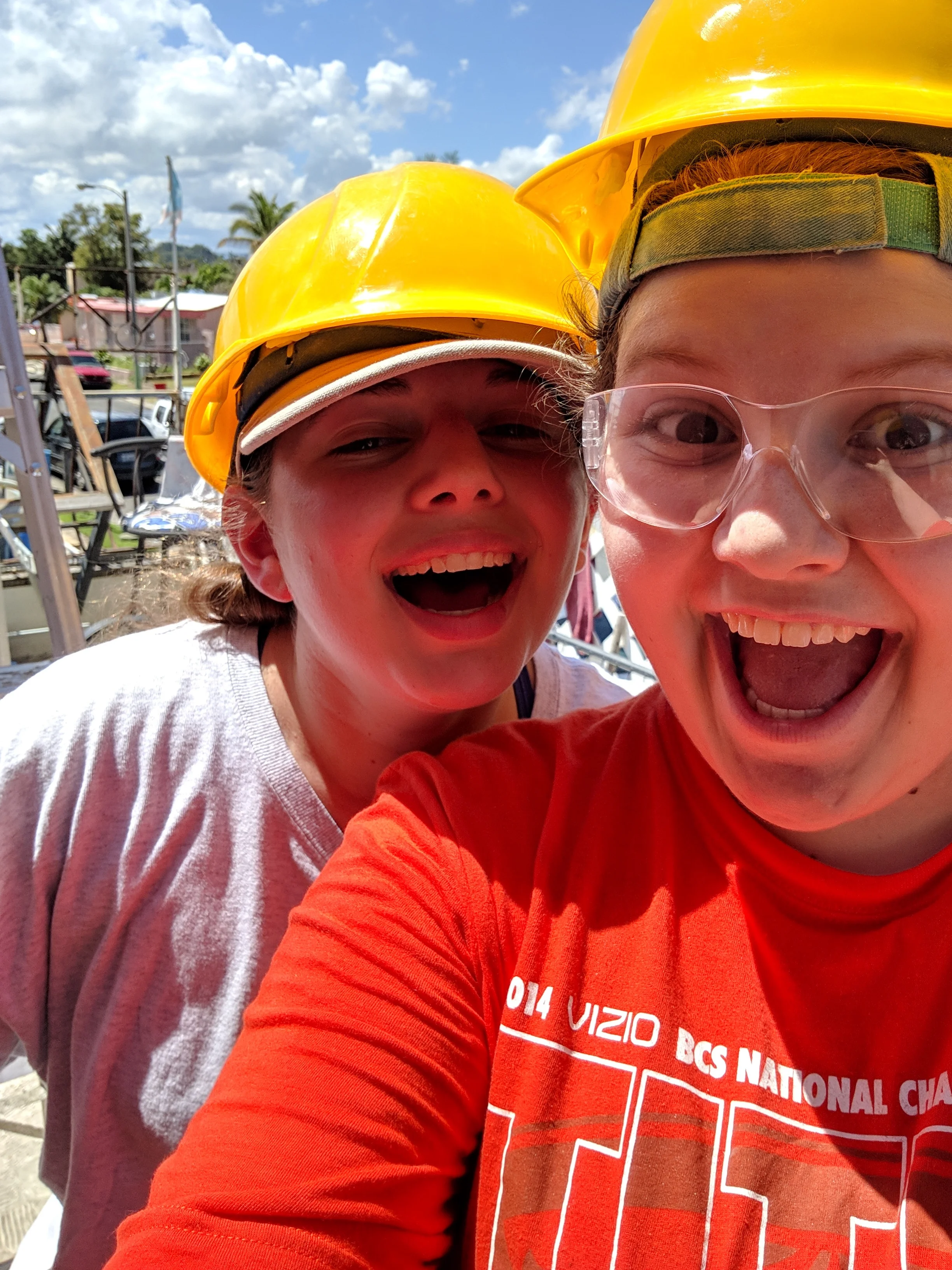 Korie Burgess and Taylor Vaughan from Team 2 smile and prepare for a day’s work
