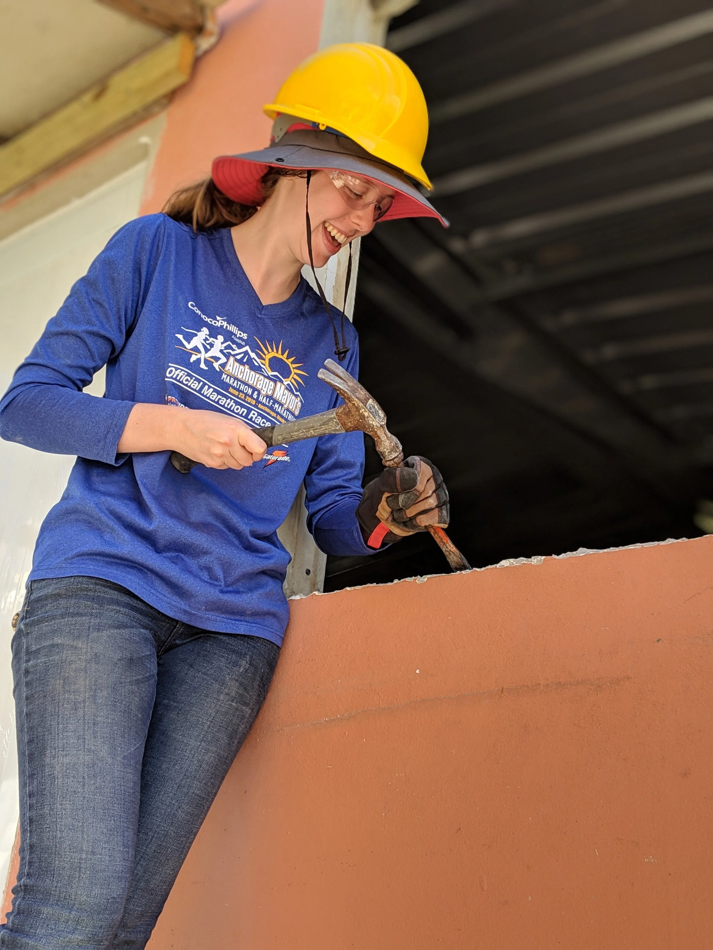 Sarah Jones from Team 2 is working on a window