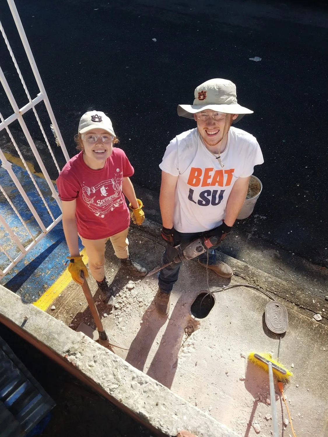 Bekah Wommack and Ben Gourley smile for a pic as they try to locate a pipe leak