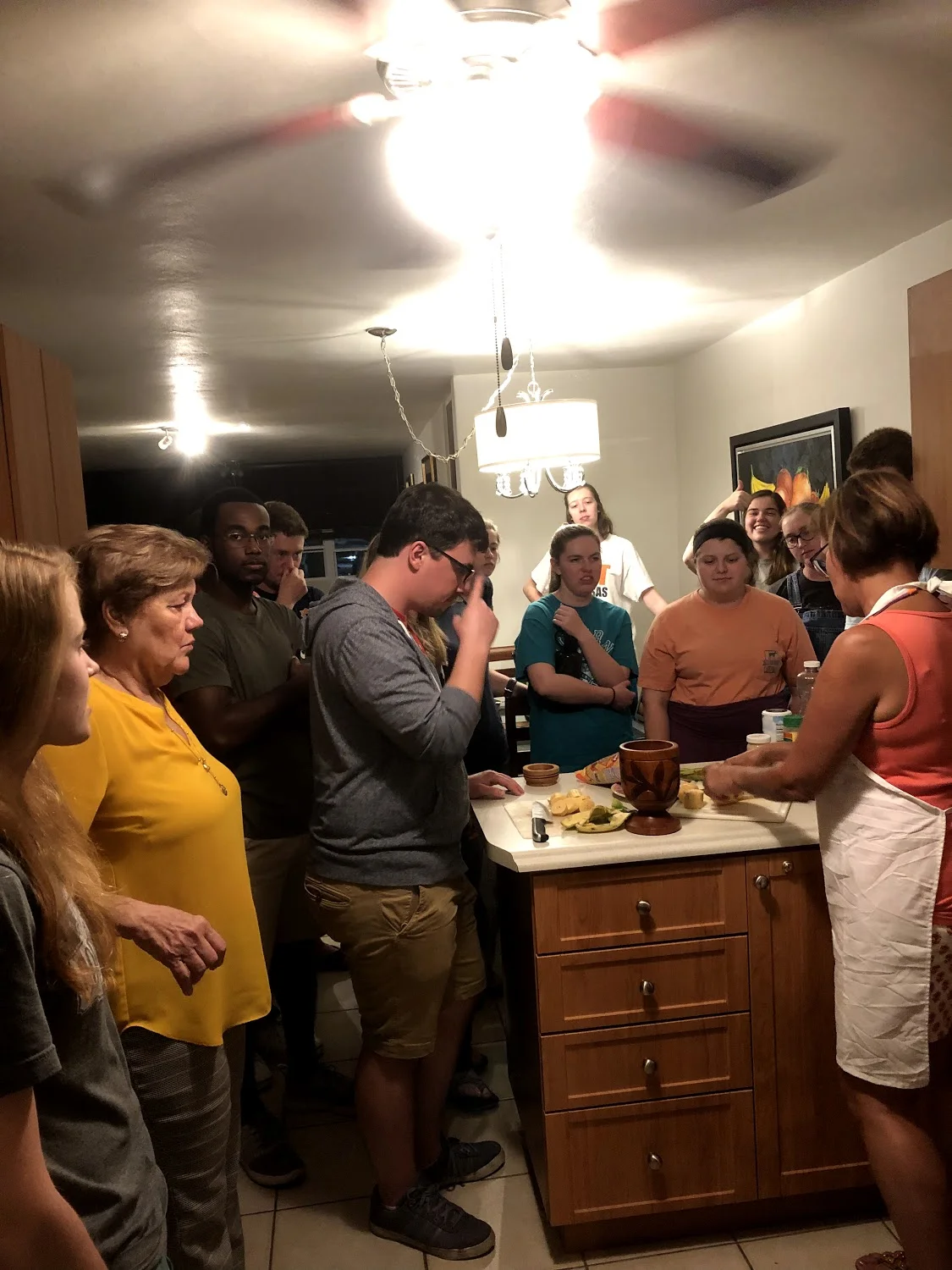 The entire team learning how to make tostones and mofongo from Ivonne, our translator