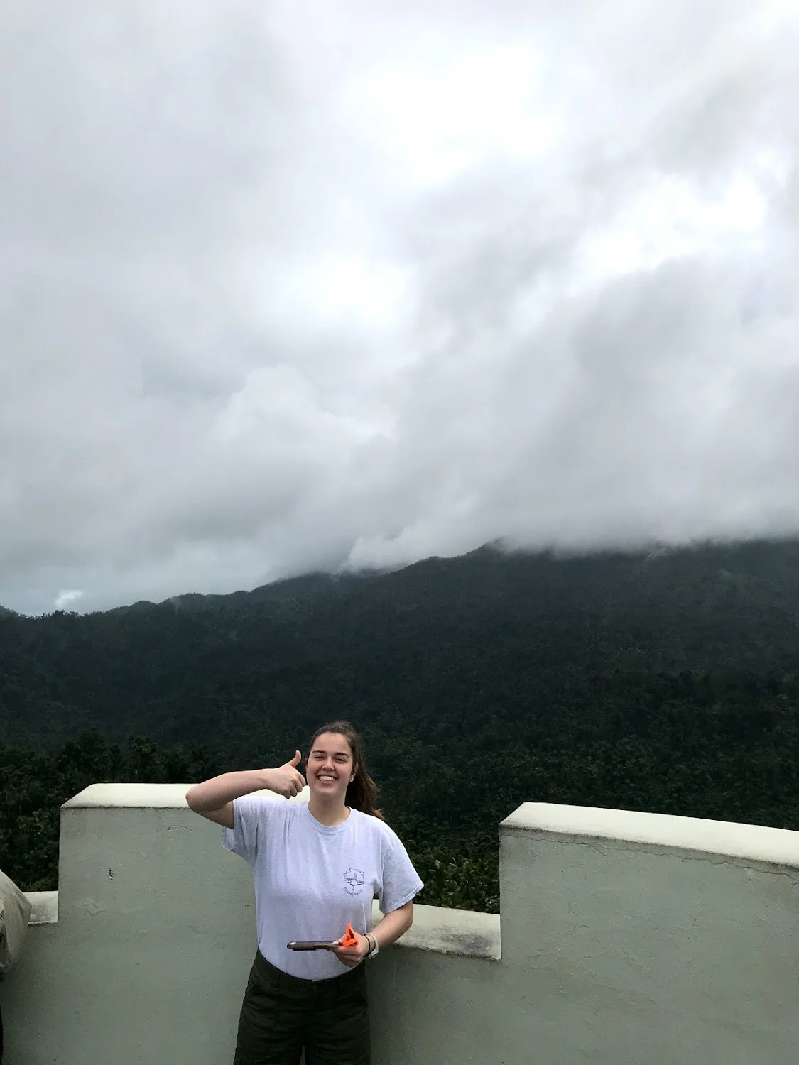 Sarah Jane Thompson smiles at the top of a lookout tower in the Yucatán Rainforest